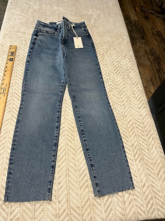 Good American Denim - Good American light blue denim jeans with raw hem detail 0/25